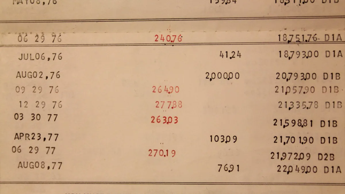 Old bank passbook page with dated deposits and running balances