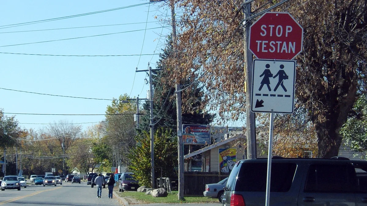 Bilingual STOP / TESTAN road sign on a street in Kahnawake, Quebec